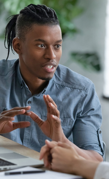 A young man and woman having a discussion.