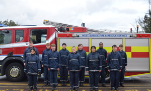 IGNITE students standing in front of a fire engine