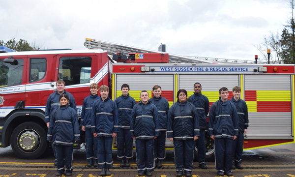 IGNITE students standing in front of a fire engine