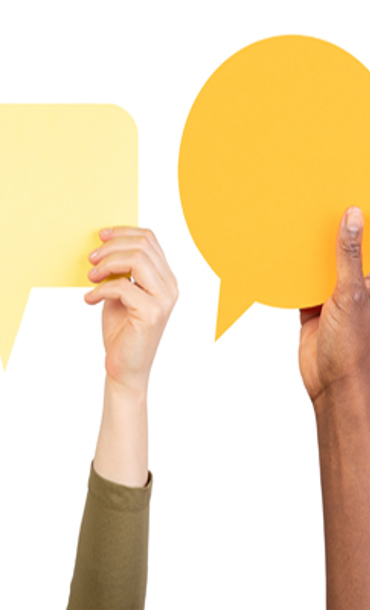 Hands holding speech bubbles