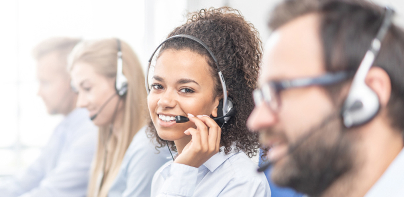 nojs Telephone advisors wearing headsets.