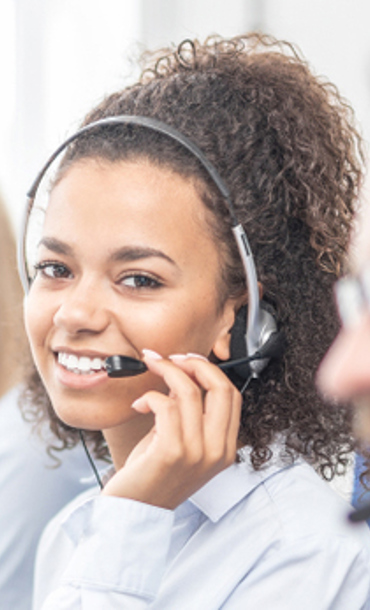 Telephone advisors wearing headsets.