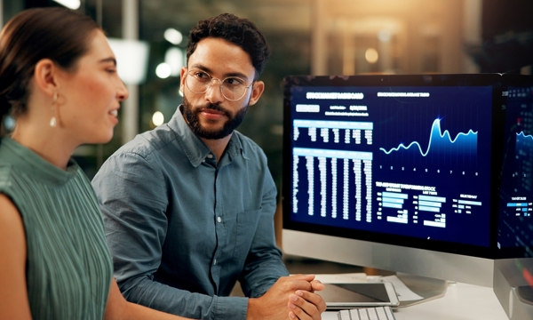 2 people looking at a computer