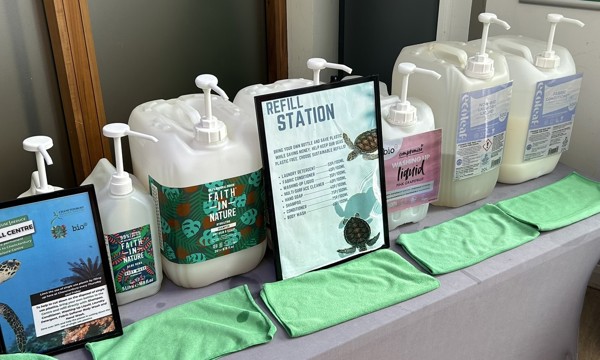 Photo of a refill station with seven containers