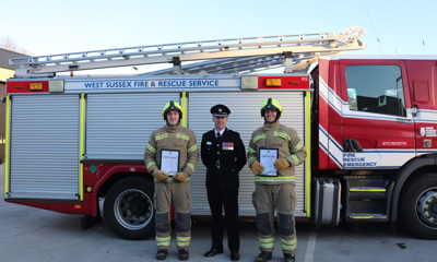 New on-call firefighters with Assistant Chief Fire Officer Gary Ball in front of a fire engine
