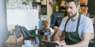 A man working in a cafe