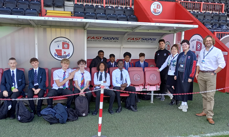 Students at Crawley Town Football Stadium