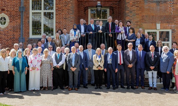 All West Sussex County Councillors standing in front of Edes House on the lawn outside County Hall, Chichester