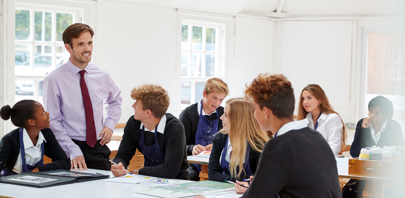 nojs Teacher with a group of students