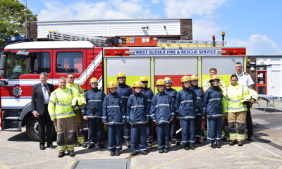 GRIT students standing in front of a fire engine