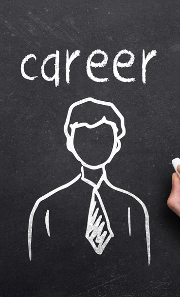 Chalk-drawn image on a blackboard of a person with arrows pointing outwards from the person and the word career above them.