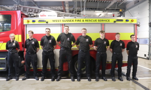 New on-call firefighters stood in front of a fire engine
