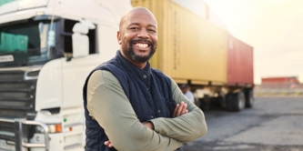 A man standing on front of a HGV