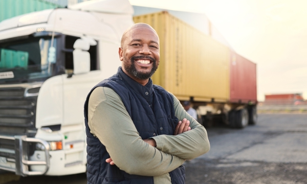 A man standing on front of a HGV