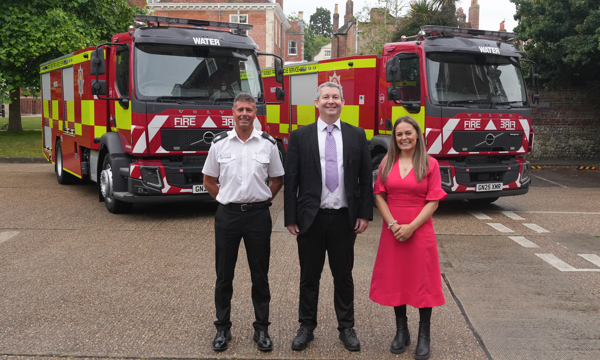 Area Manager Andy Piller, Councillor Duncan Crow and Interim Assistant Chief Officer Sabrina Pennington-Down standing in front of two water carriers