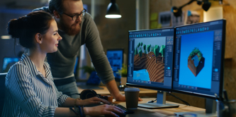 2 people looking at a computer screen